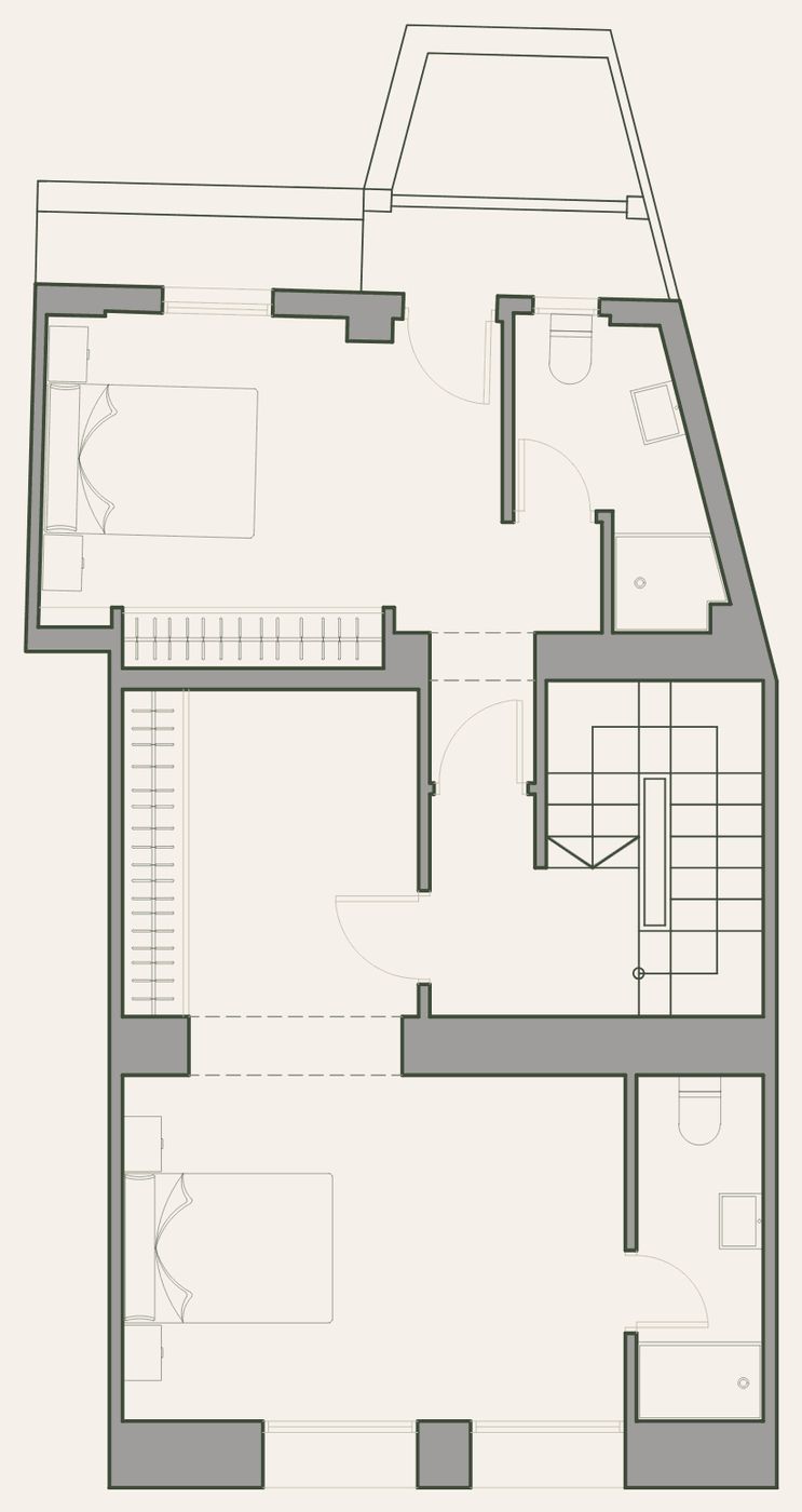 Plano de la planta primera: dos dormitorios con baño y balcón.